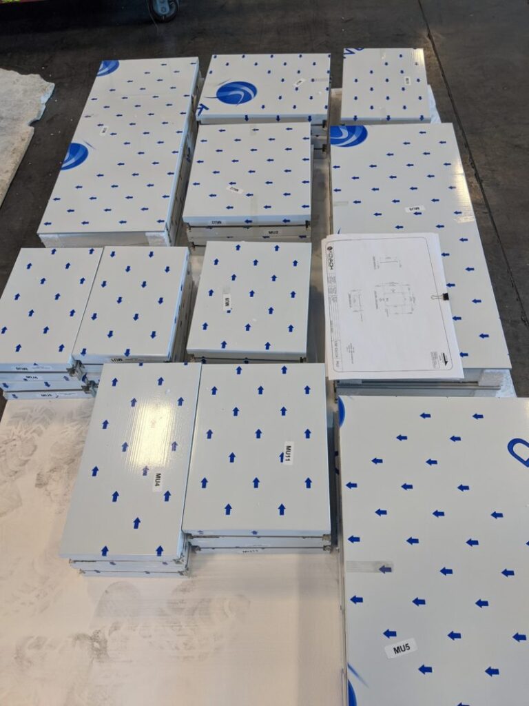 metal panels laying in floor