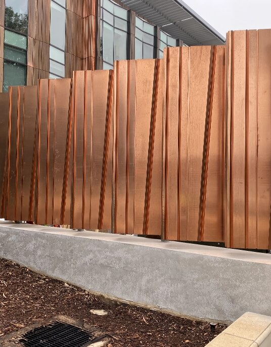 closeup copper metal panel systems on exterior of building